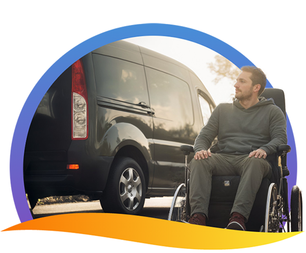 Man on a wheelchair in front of a van