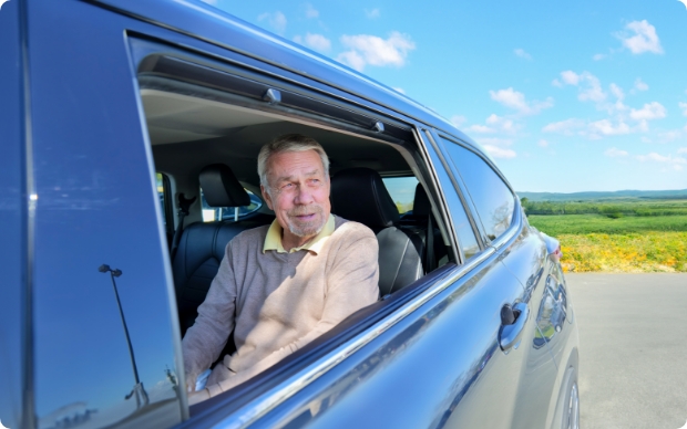 A man looking out the car window